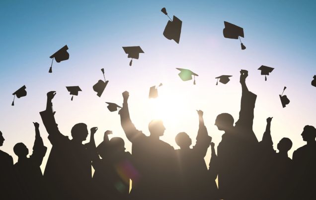 GraduationHatsThrownIntoTheAir-1400x891